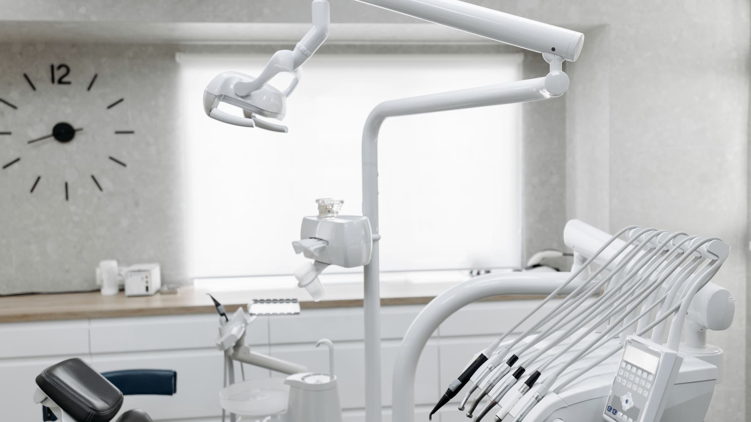 Dental delivery system, overhead light, handpieces, and operatory equipment in a working clinic