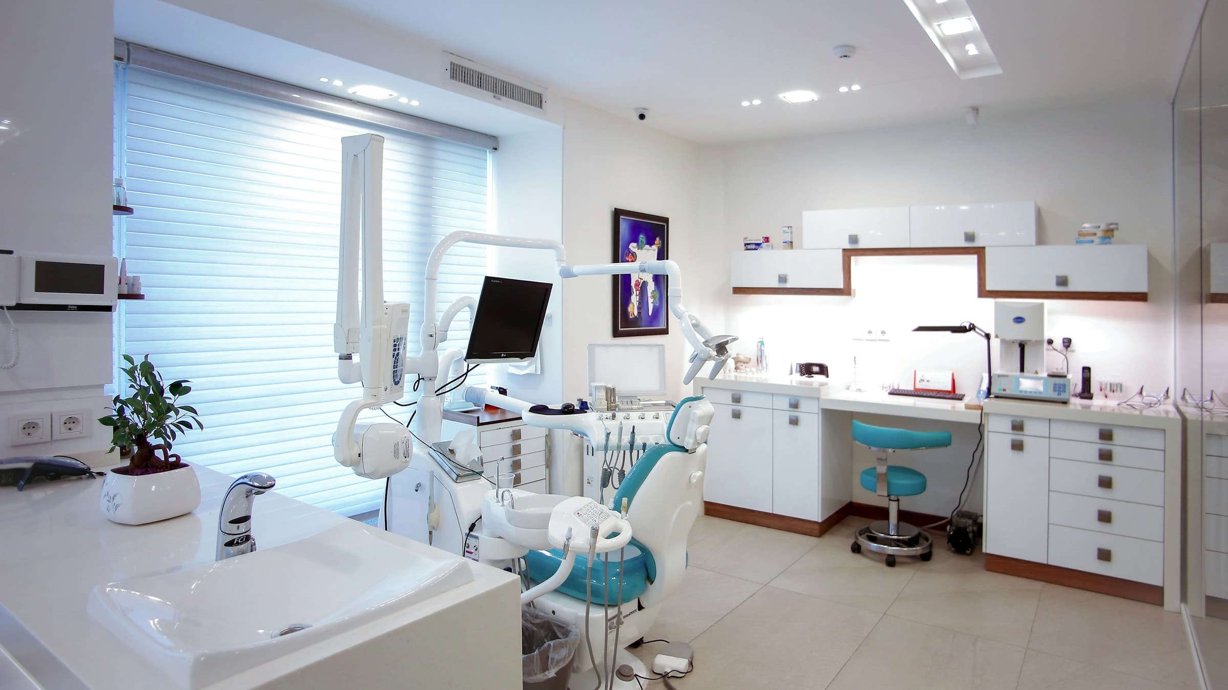 Fully equipped modern dental operatory prepared for patients