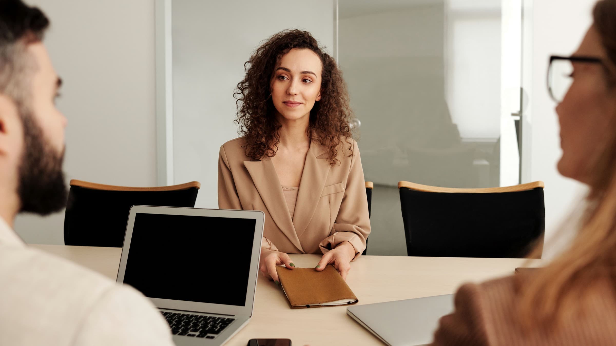 Staffing agency recruiter reviewing a hiring plan with a client