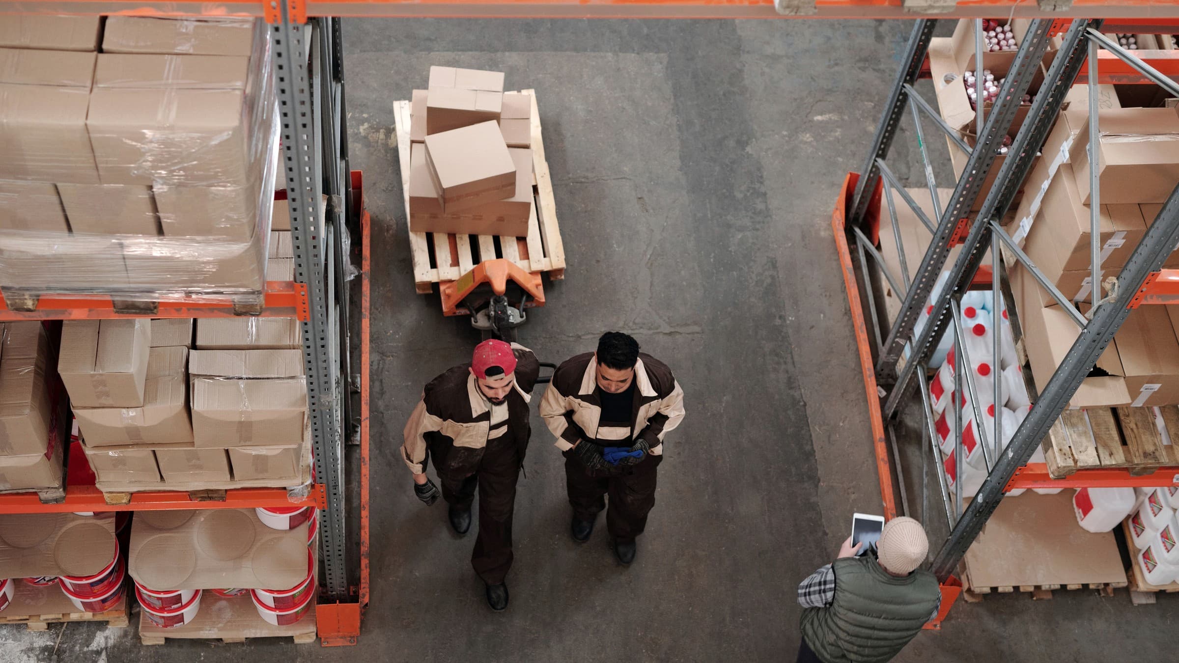 Distributor visiting a supplier warehouse and checking boxed products